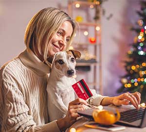 woman shopping on computer with a credit card